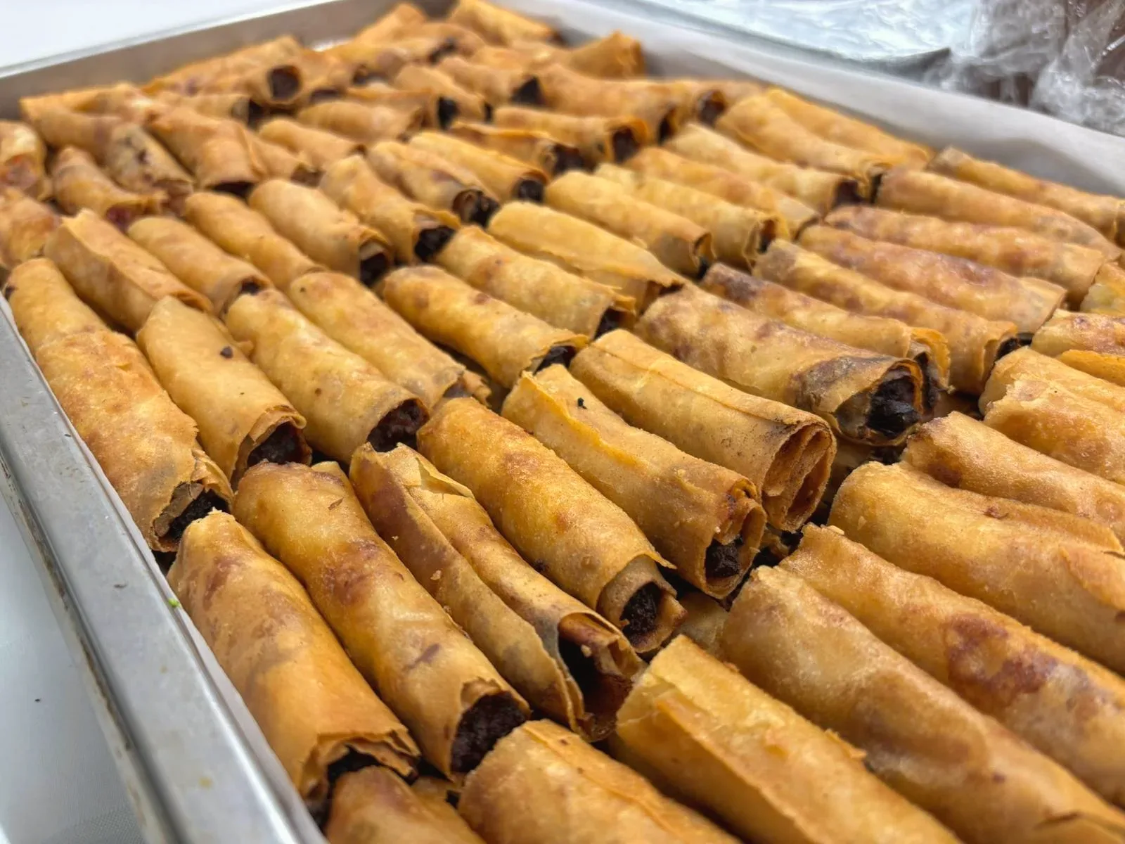 Hand-rolled Lumpya Shanghai from Casa Manila — crisp golden spring rolls fresh from the kitchen
