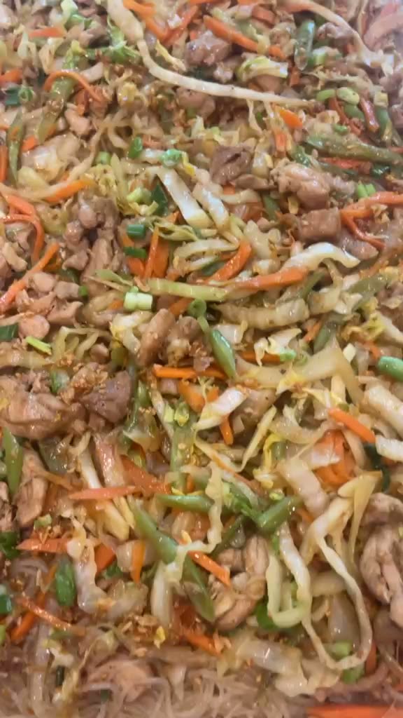 Pancit going onto the tray